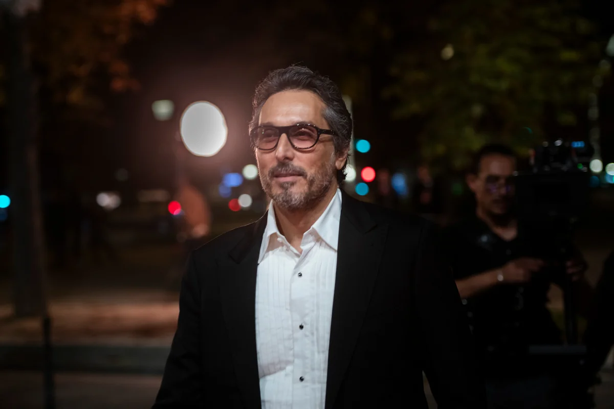 A guest in a suit at the entrance to a reception.