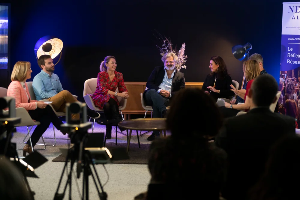 A small-group discussion in front of an audience.